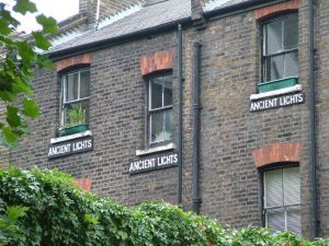 Ancient lights signs below windows in Clerkenwell, London. Mike Newman